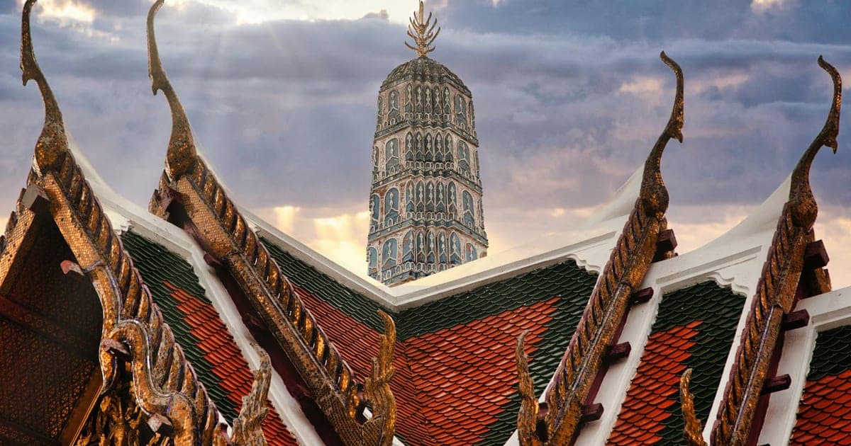 Wat Arun temple at sunset with the Chao Phraya River in Bangkok