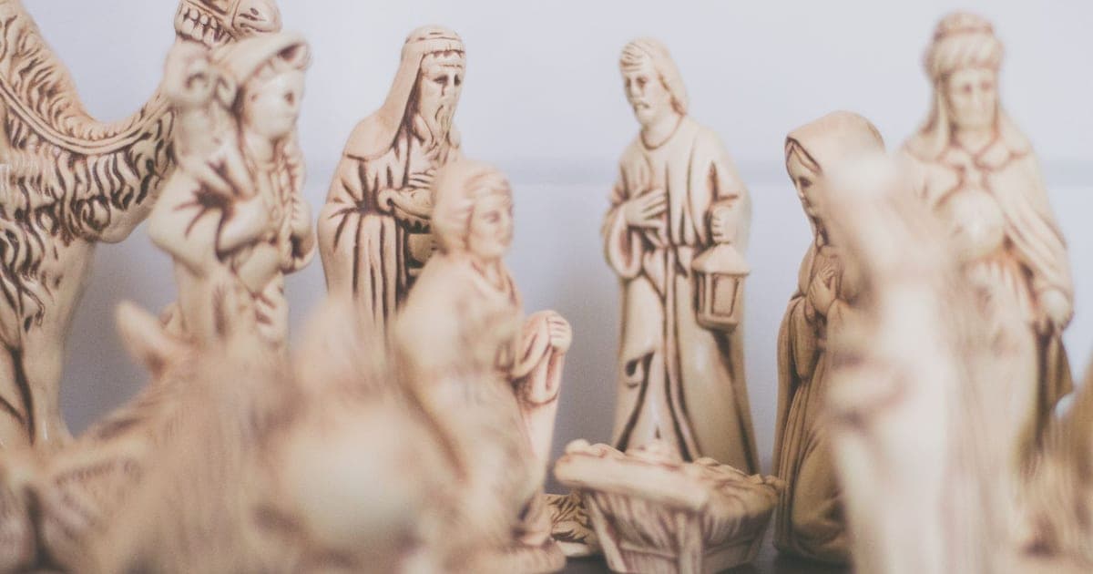 Ceramic nativity figurines with the three kings, a camel and the manger