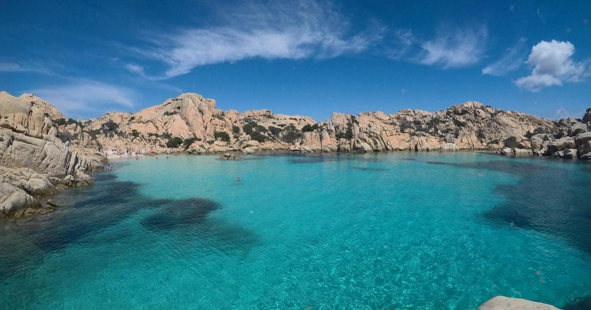 Cala Goloritzé in Sardinia with turquoise water and limestone cliffs