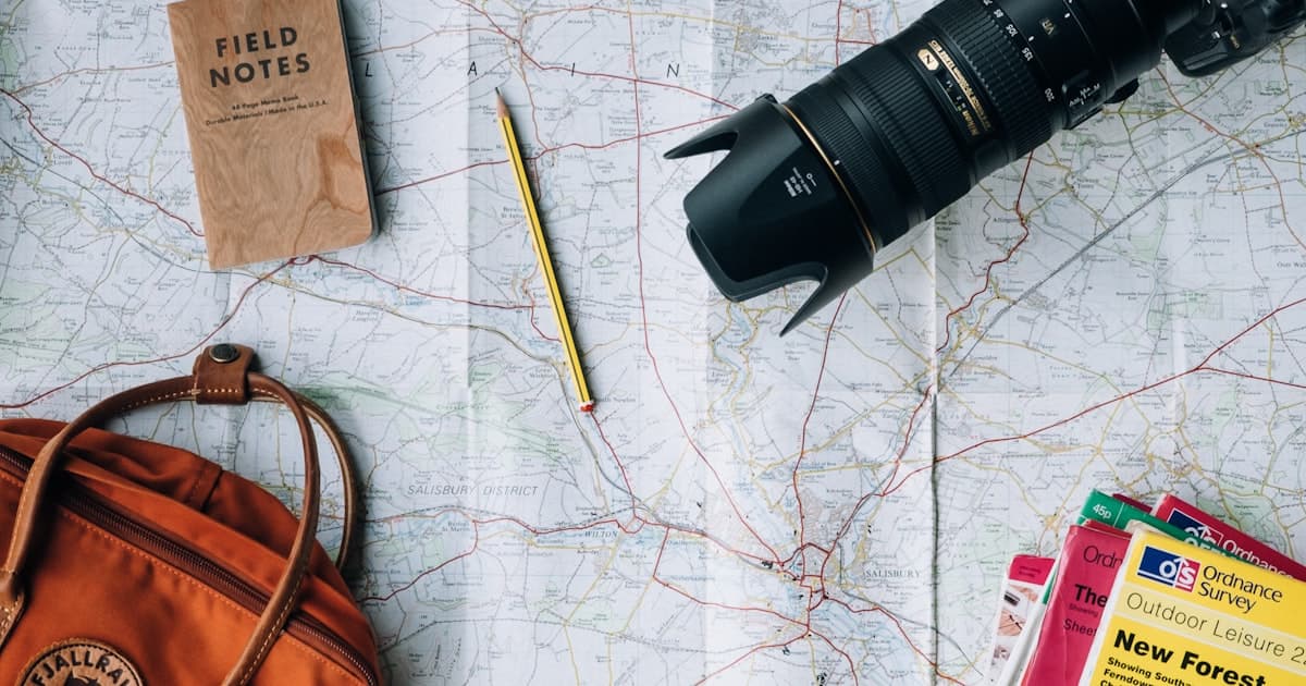 AI trip planning shown on a laptop and phone screen